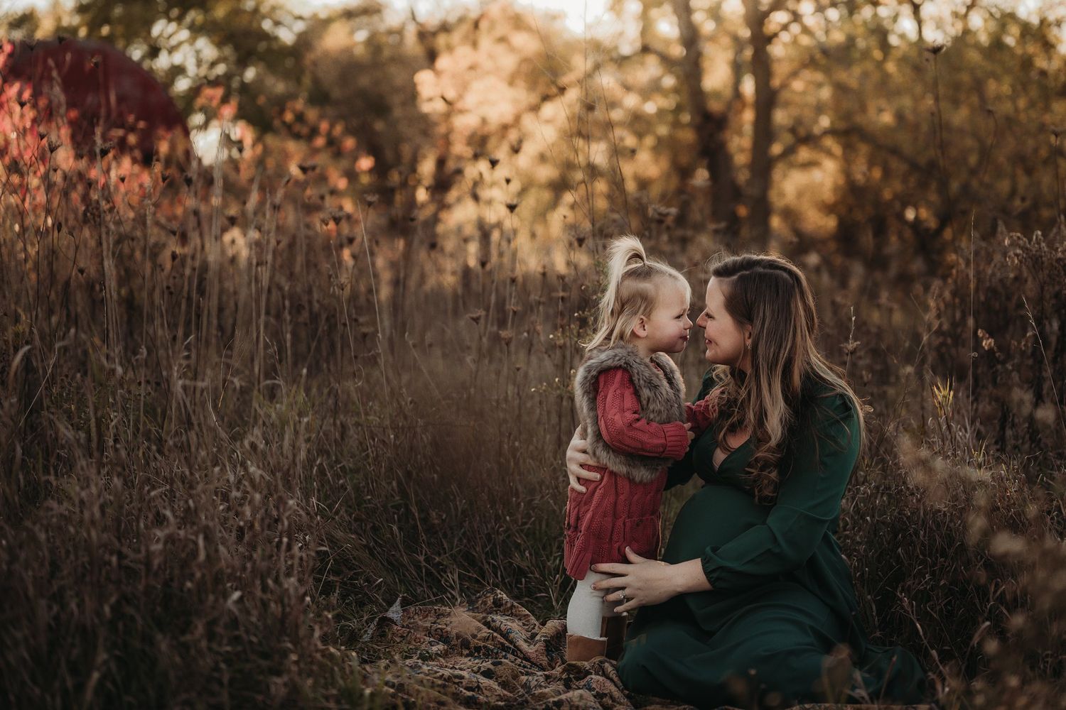 Tender outdoor portrait session in rustic fall setting.