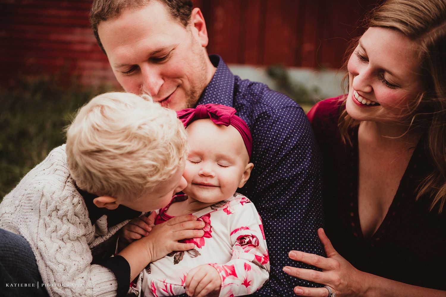 An intimate family moment captured showing affection and laughter.