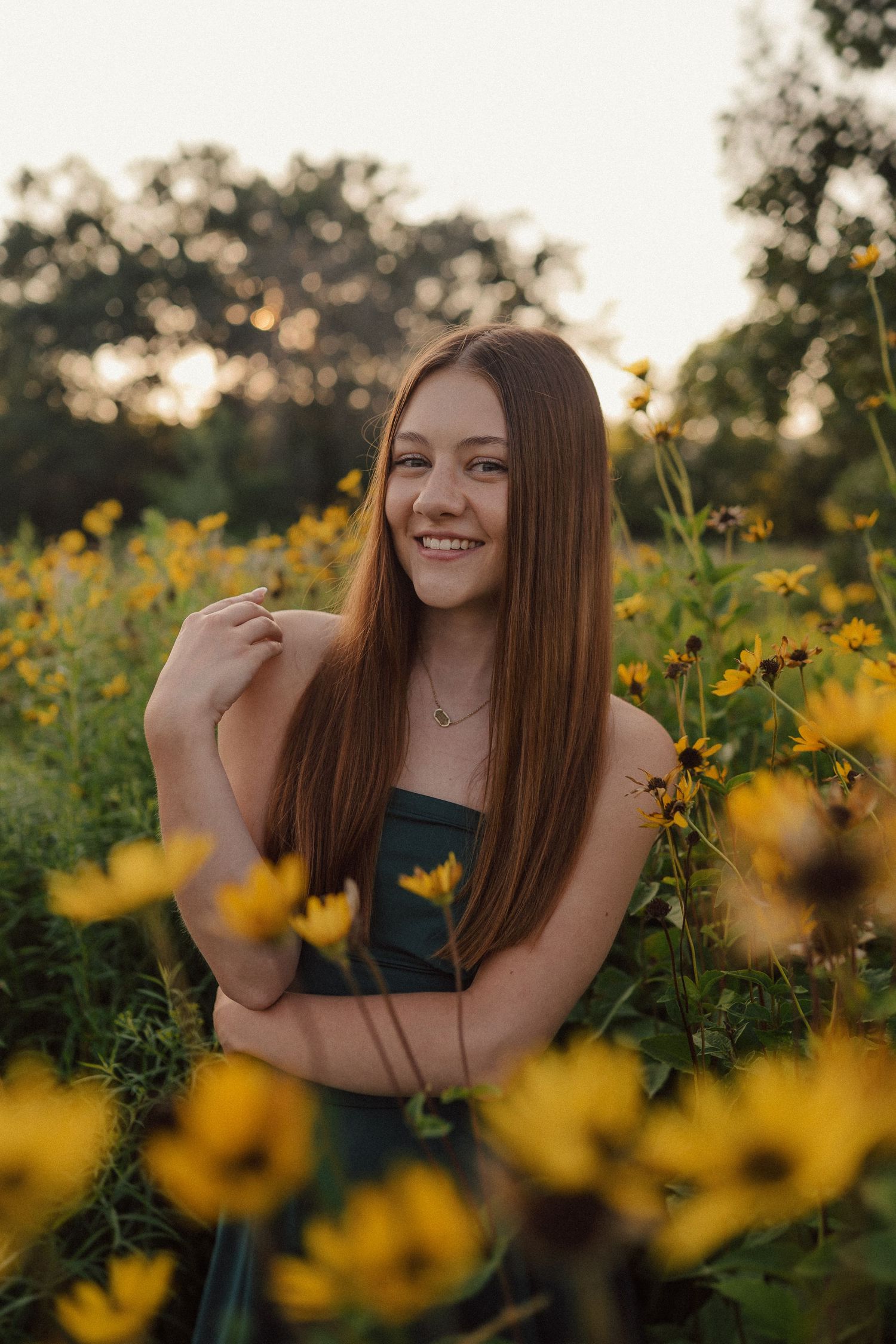 A candid series of outdoor portraits in a blooming sunflower field at golden hour.
