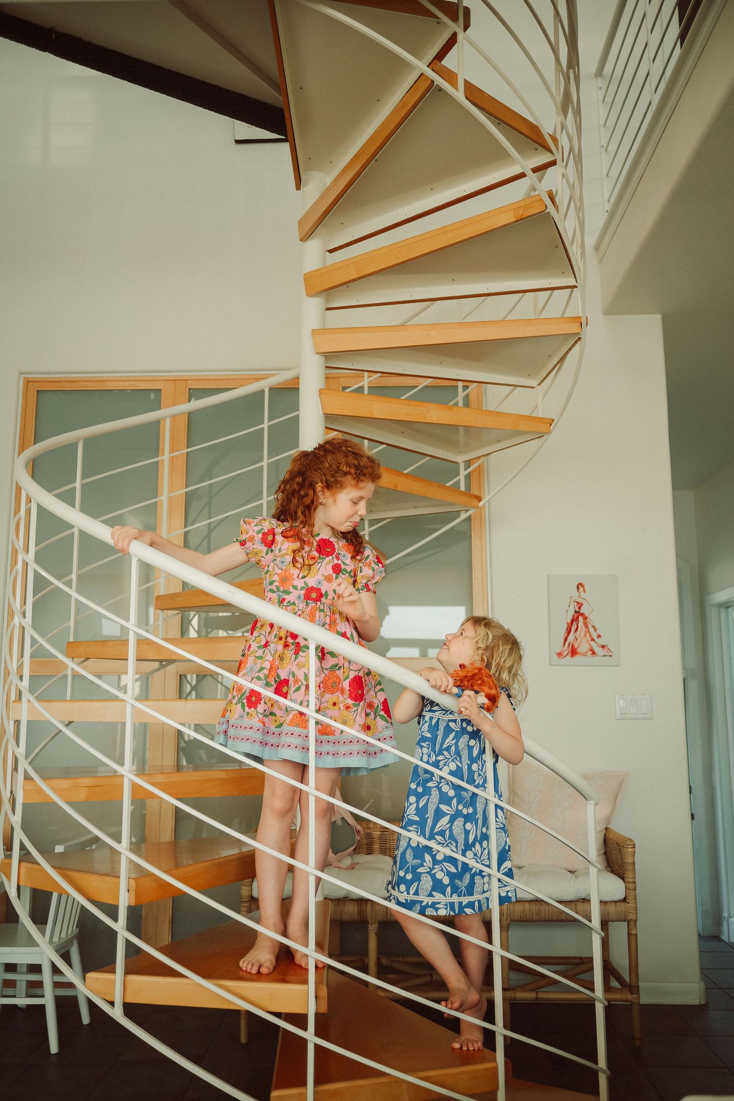 A sequence of playful moments captured on a modern wooden staircase with white railings.