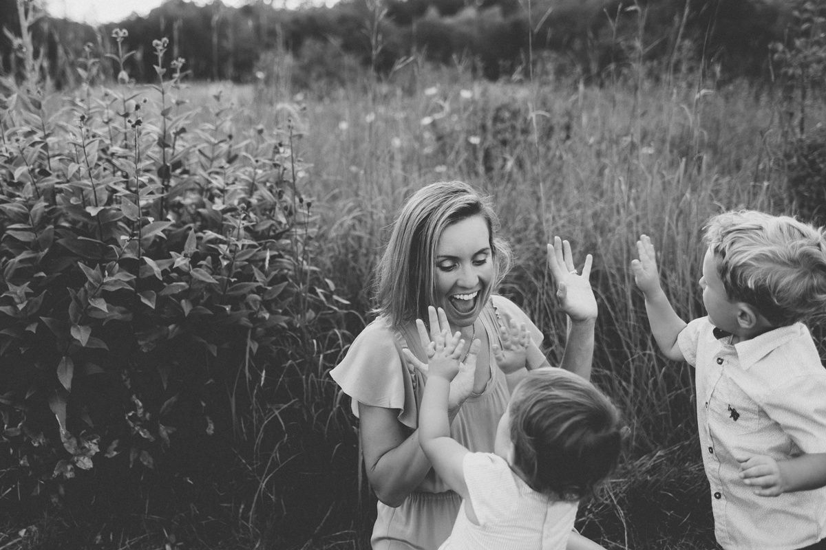 Joyful outdoor playtime moment captured in black and white photography.