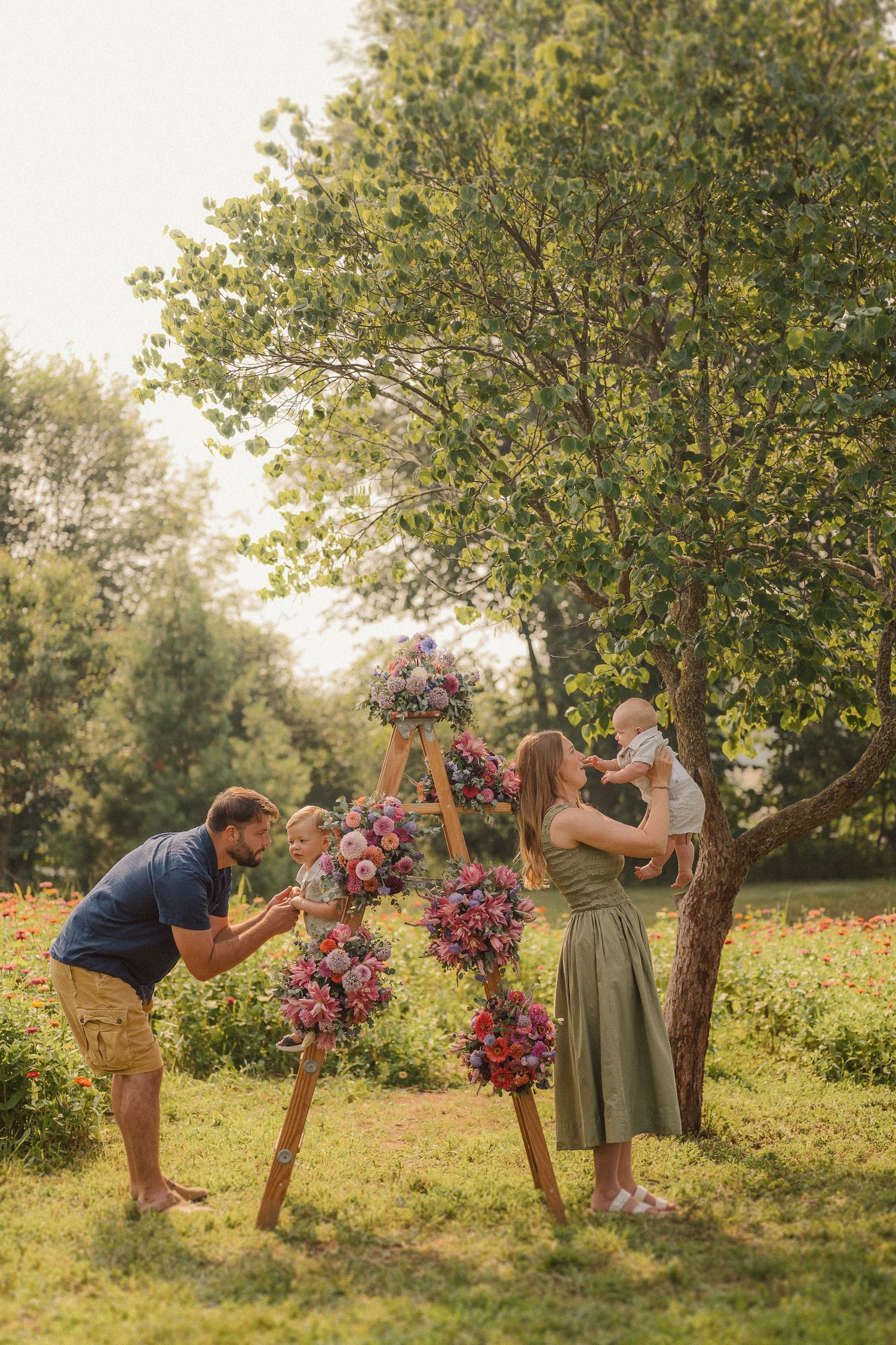 Playful outdoor photo sequence with wooden flower stands and people interacting in a garden setting.