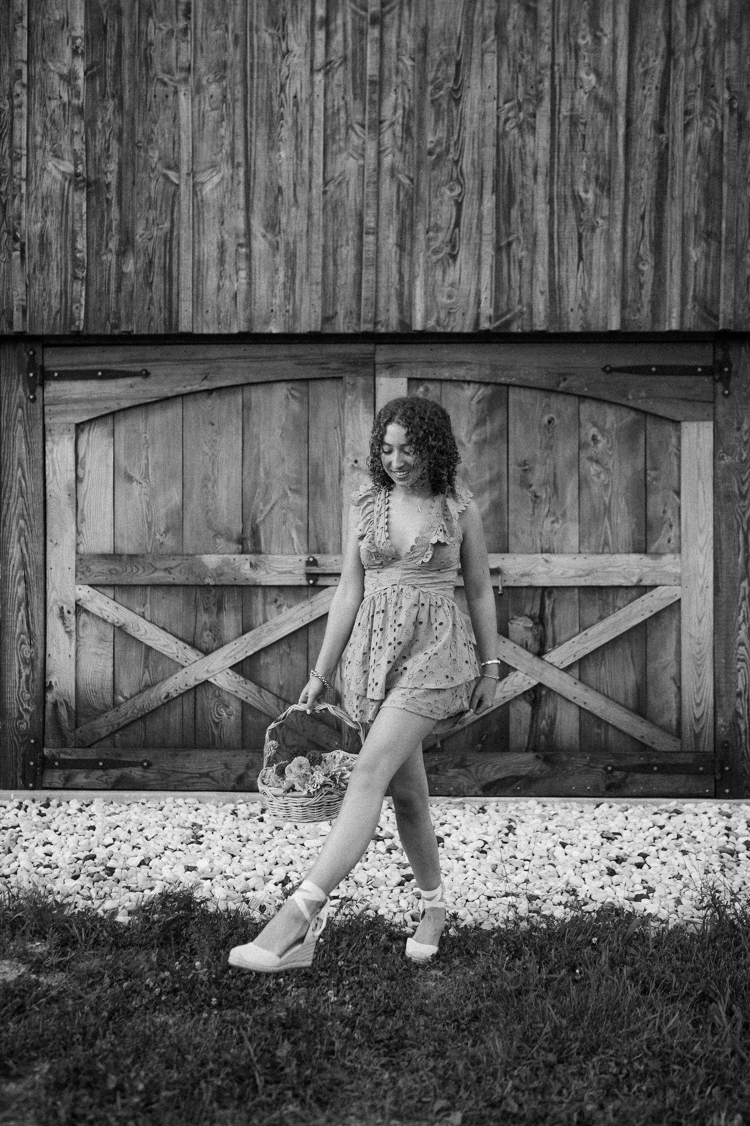 Artistic black and white portrait series against weathered barn wood backdrop.