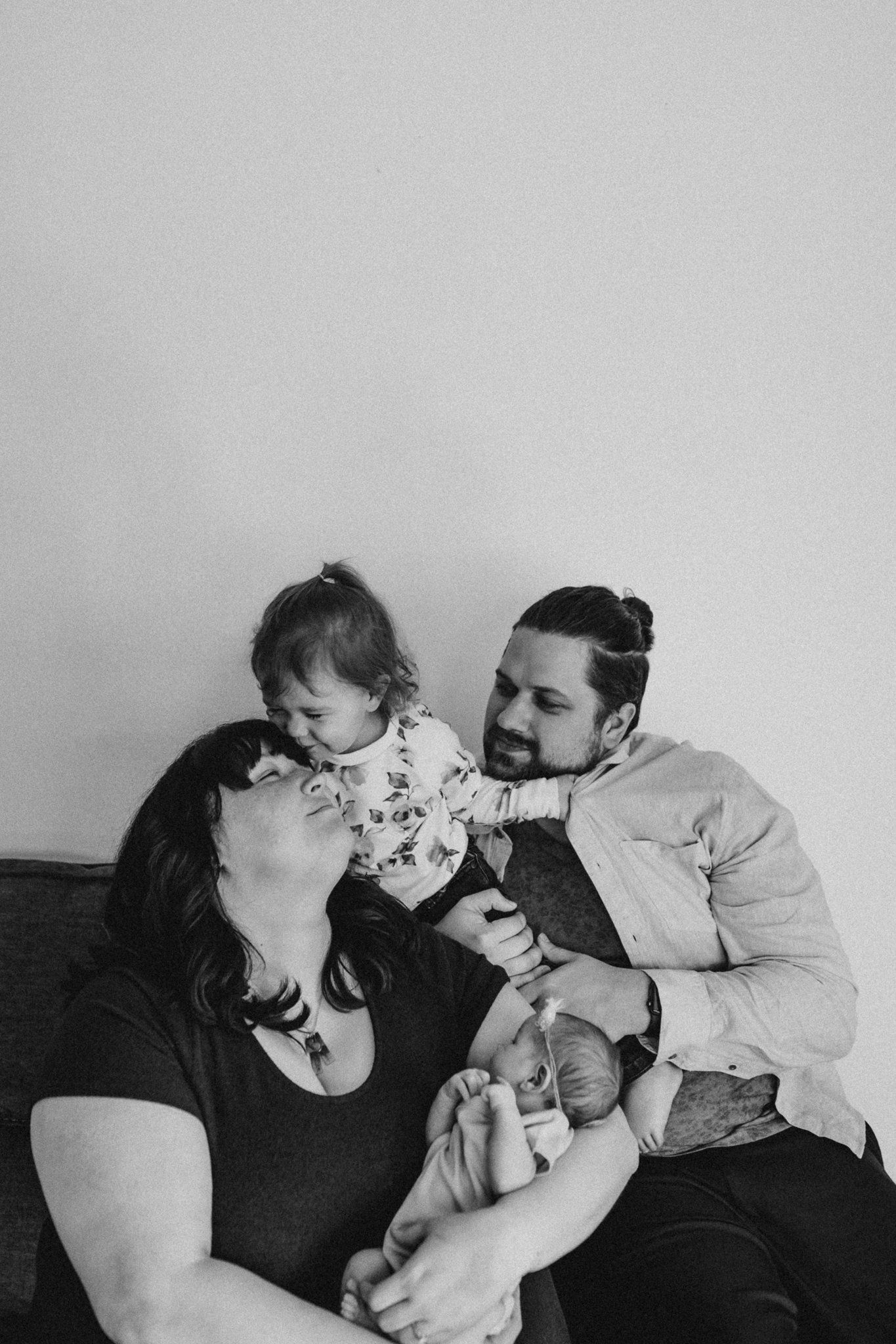 Emotional black and white family photograph showing connection and joy.