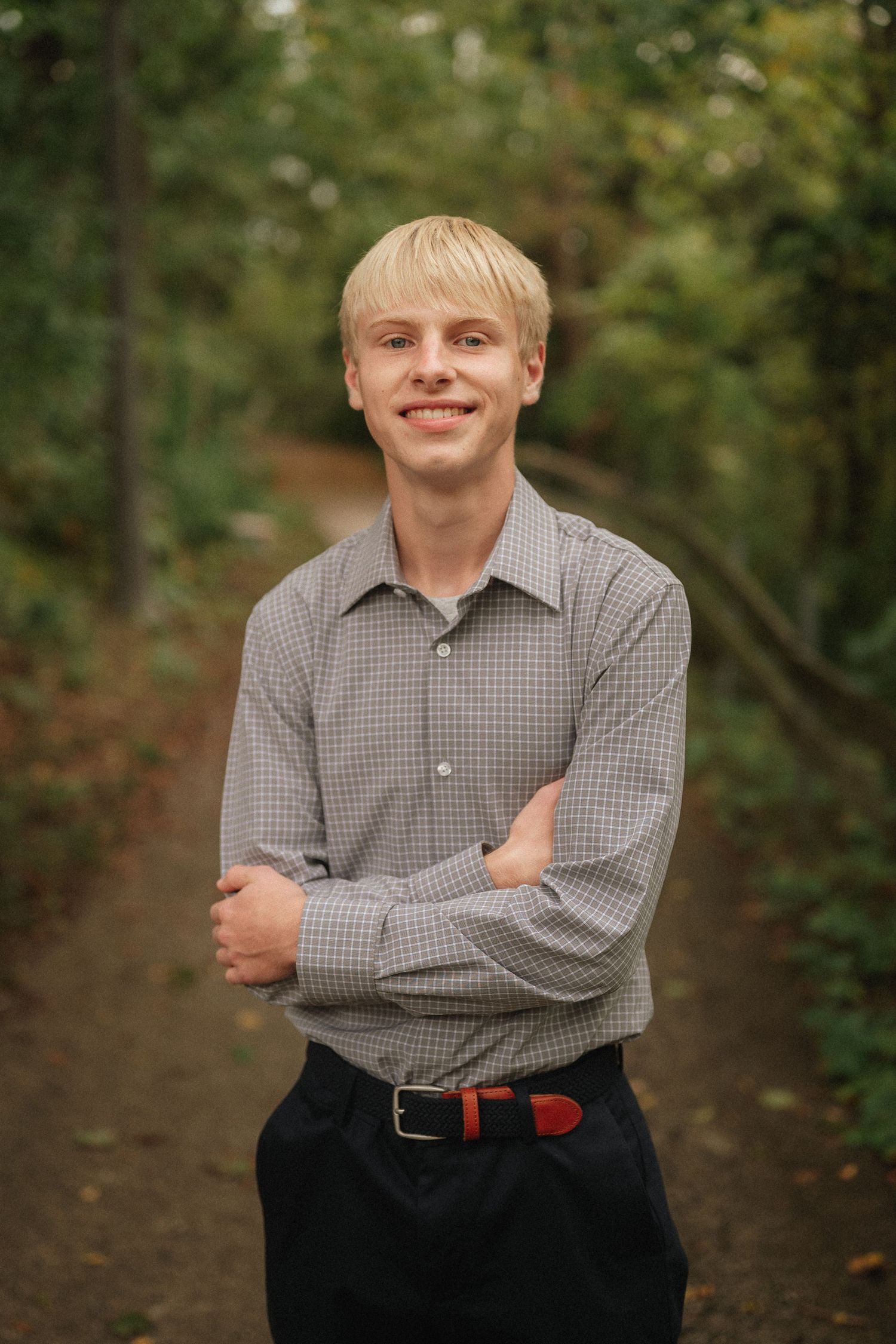 Multiple poses in a casual checkered shirt against a natural outdoor backdrop with trees.