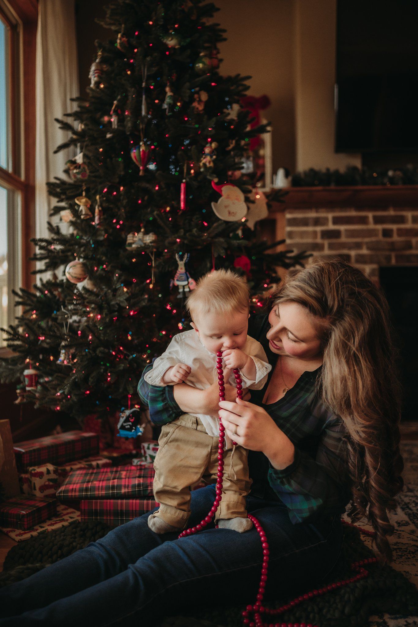 Warm Christmas scene with red beaded decorations and twinkling tree lights.