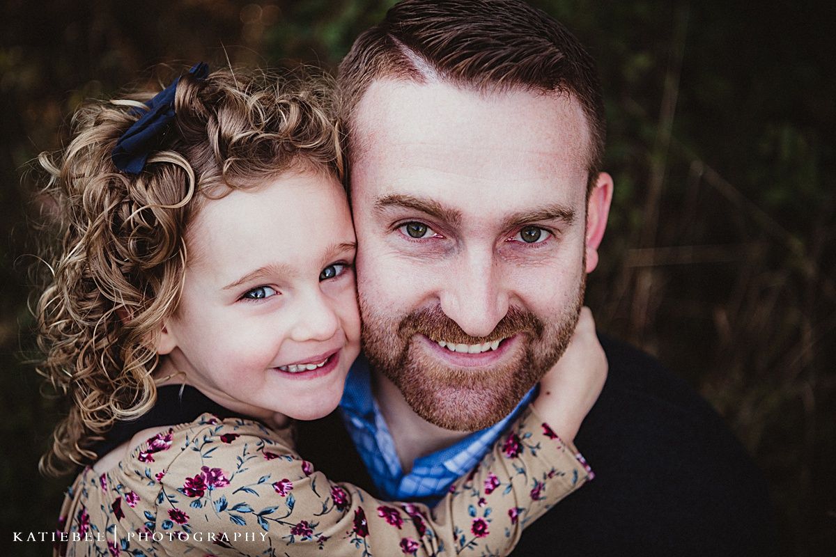 Joyful portrait against natural autumn background showing genuine connection and happiness.