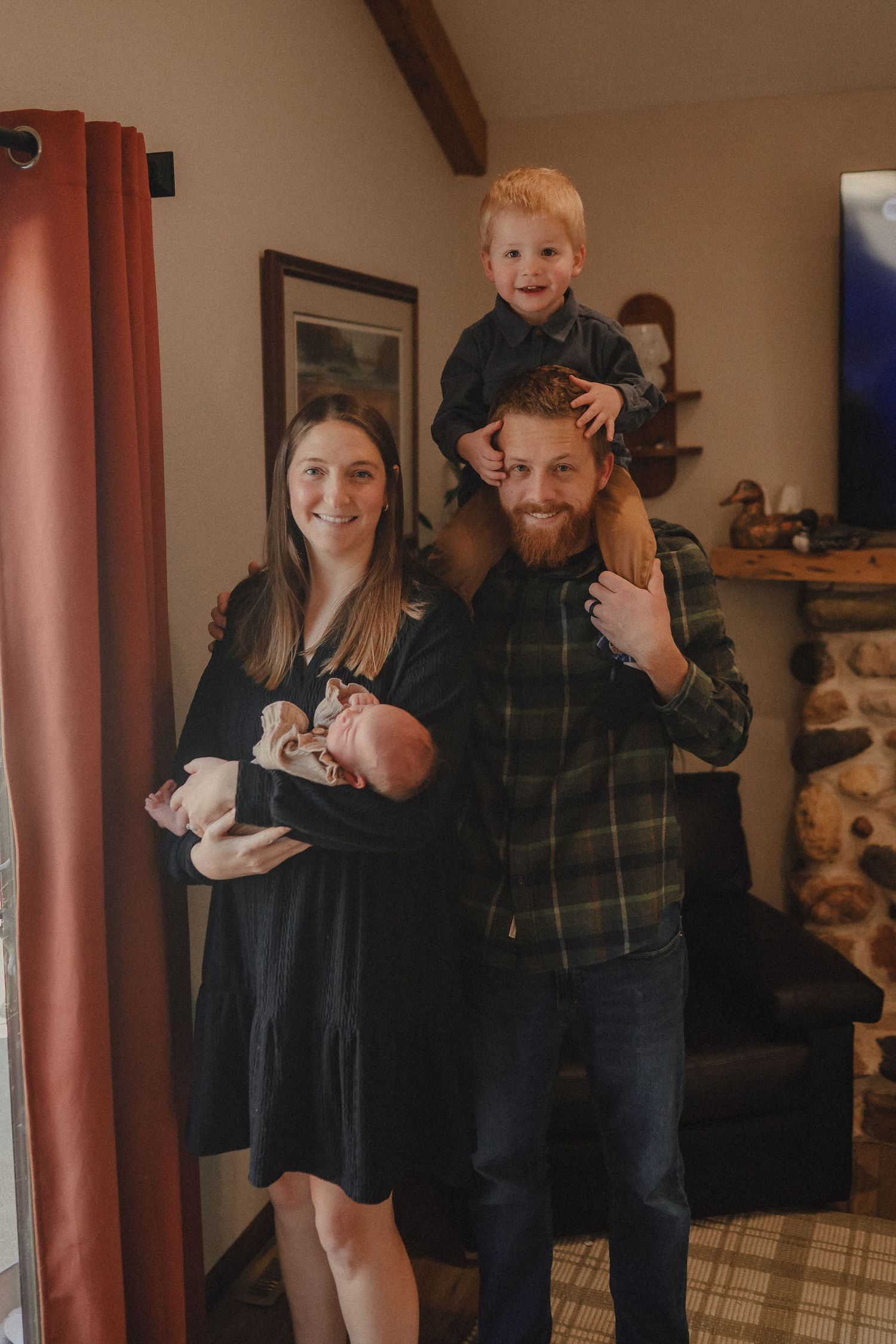 Family photoshoot sequence in a cozy living room with warm lighting and rustic decor.