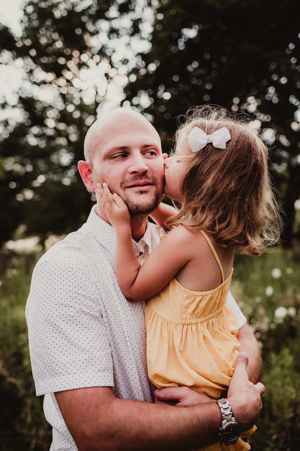 Candid portrait capturing sweet moment in golden summer light.