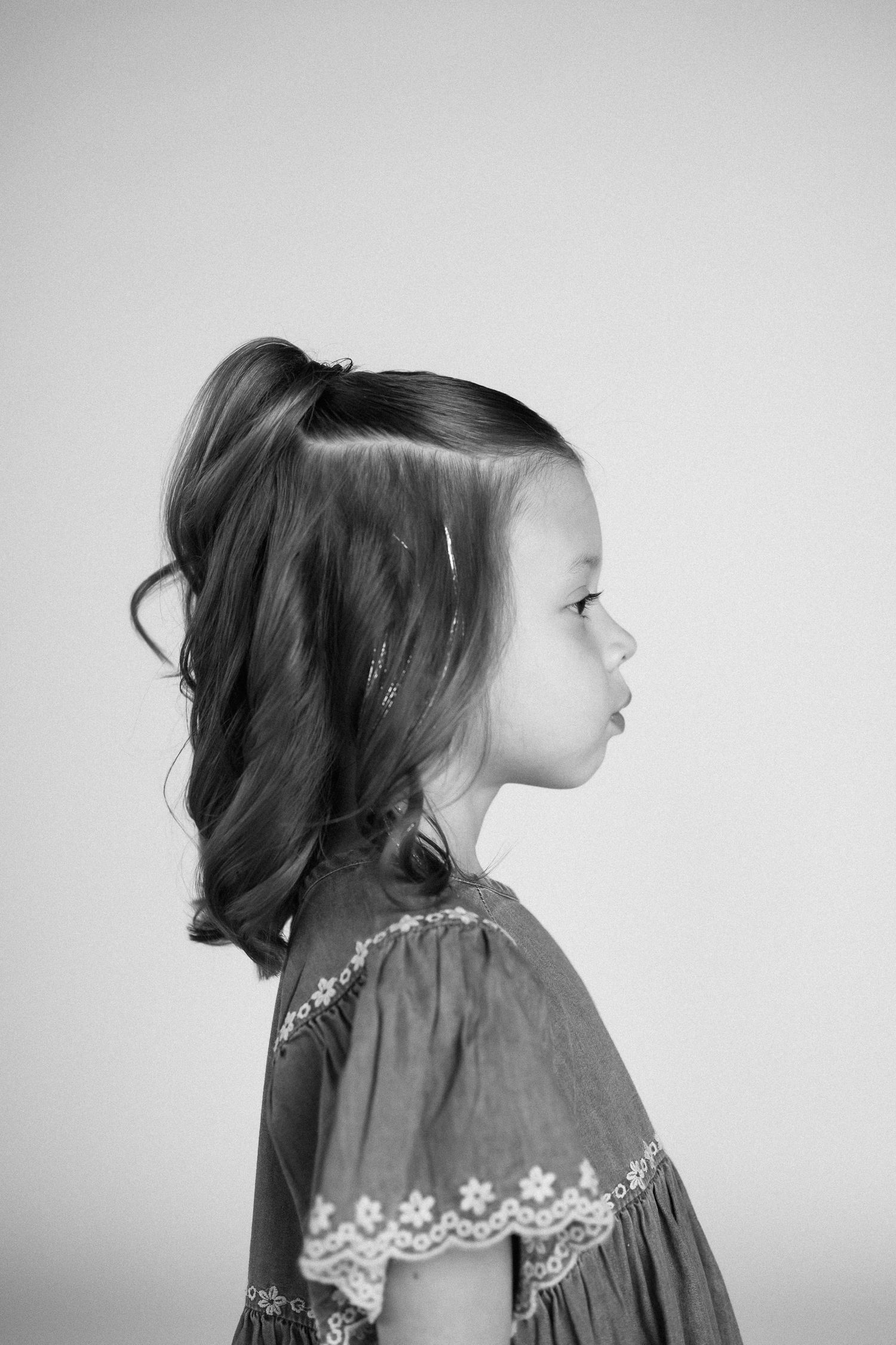 Black and white profile view portrait series showing a person in a dress with lace trim details.