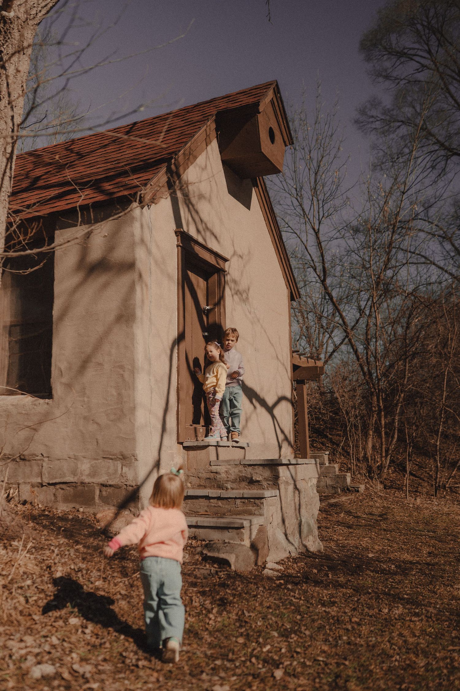 Children explore an old abandoned building in a series of outdoor adventure photos.