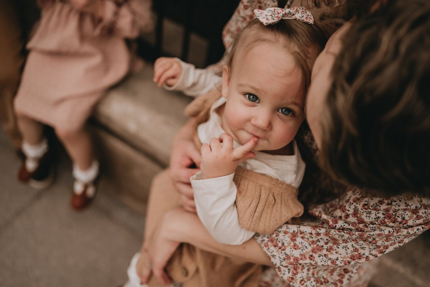 A close-up shot capturing a joyful moment between family members outdoors.