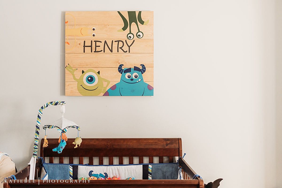 Wooden nursery wall art with monsters and the name Henry.
