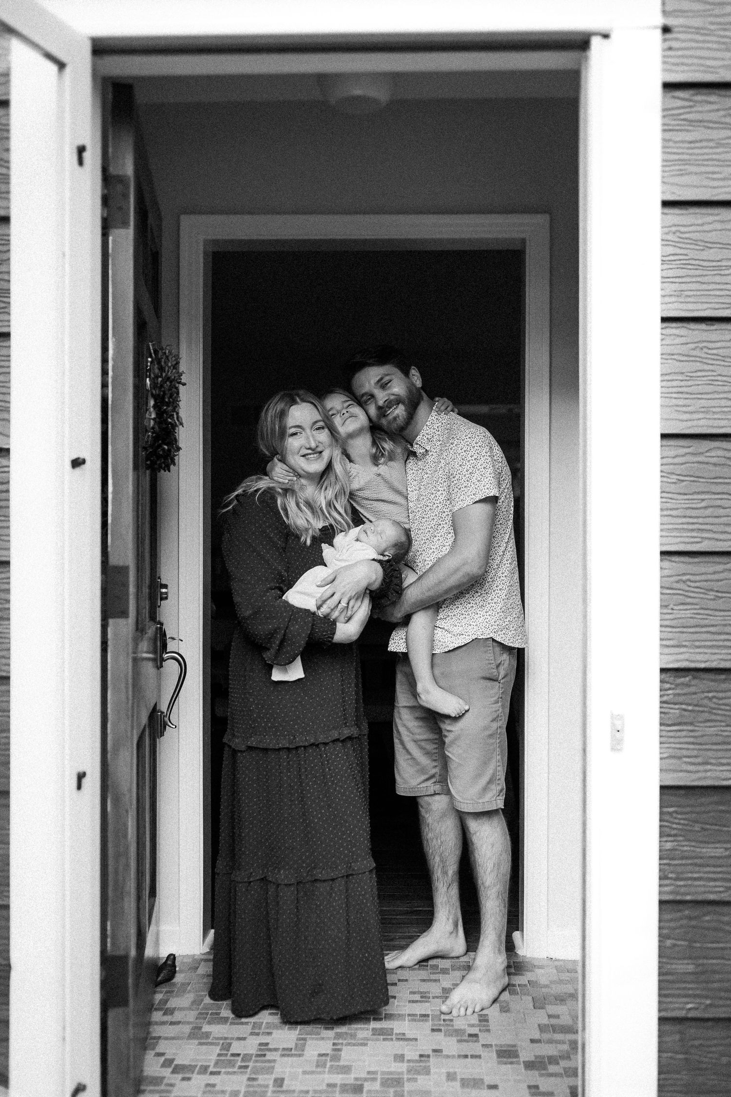 A collection of candid doorway photos showing affectionate family moments within a white door frame.