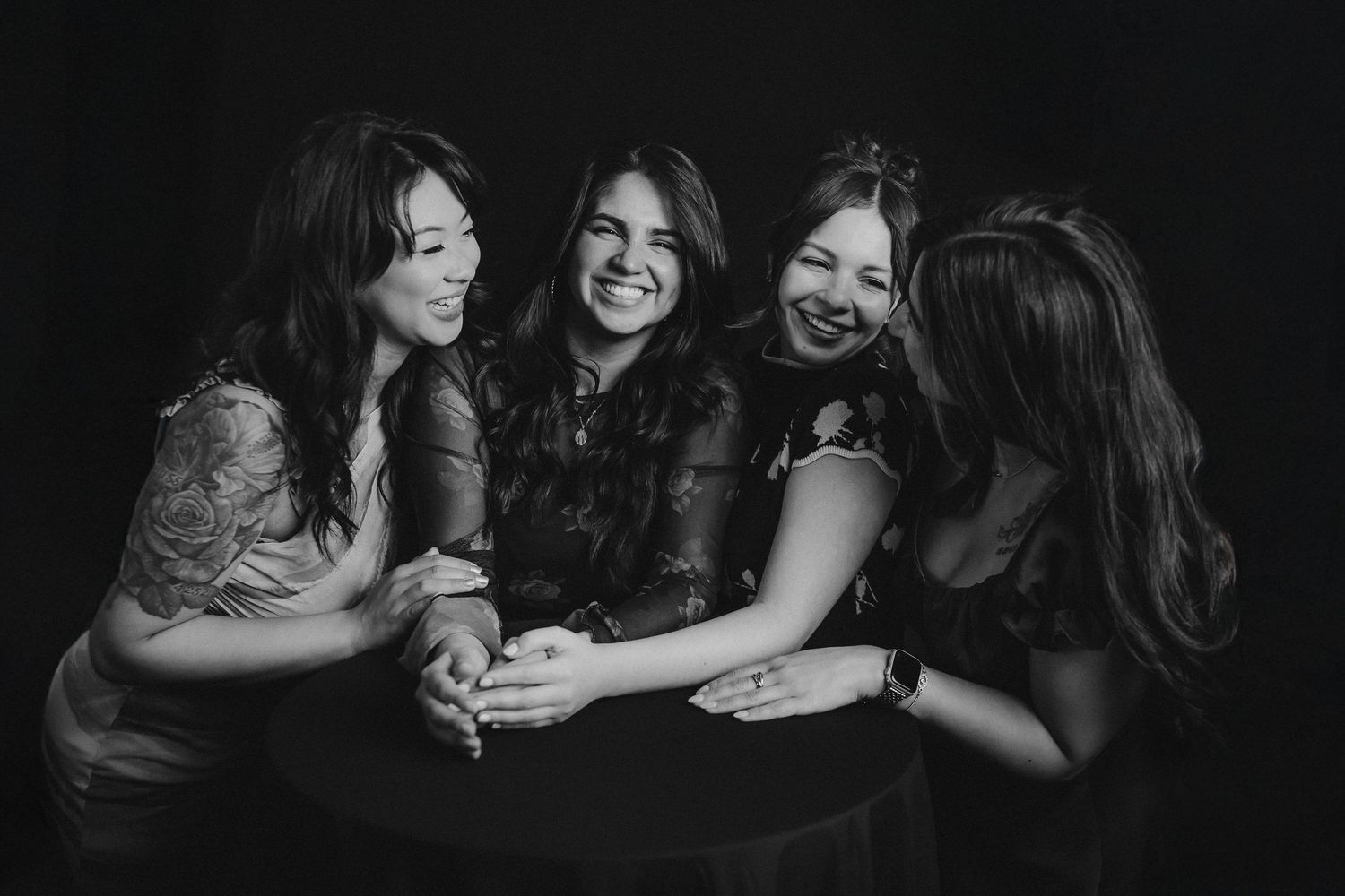 Black and white photo series showing joyful group moments with natural laughter and embraces.