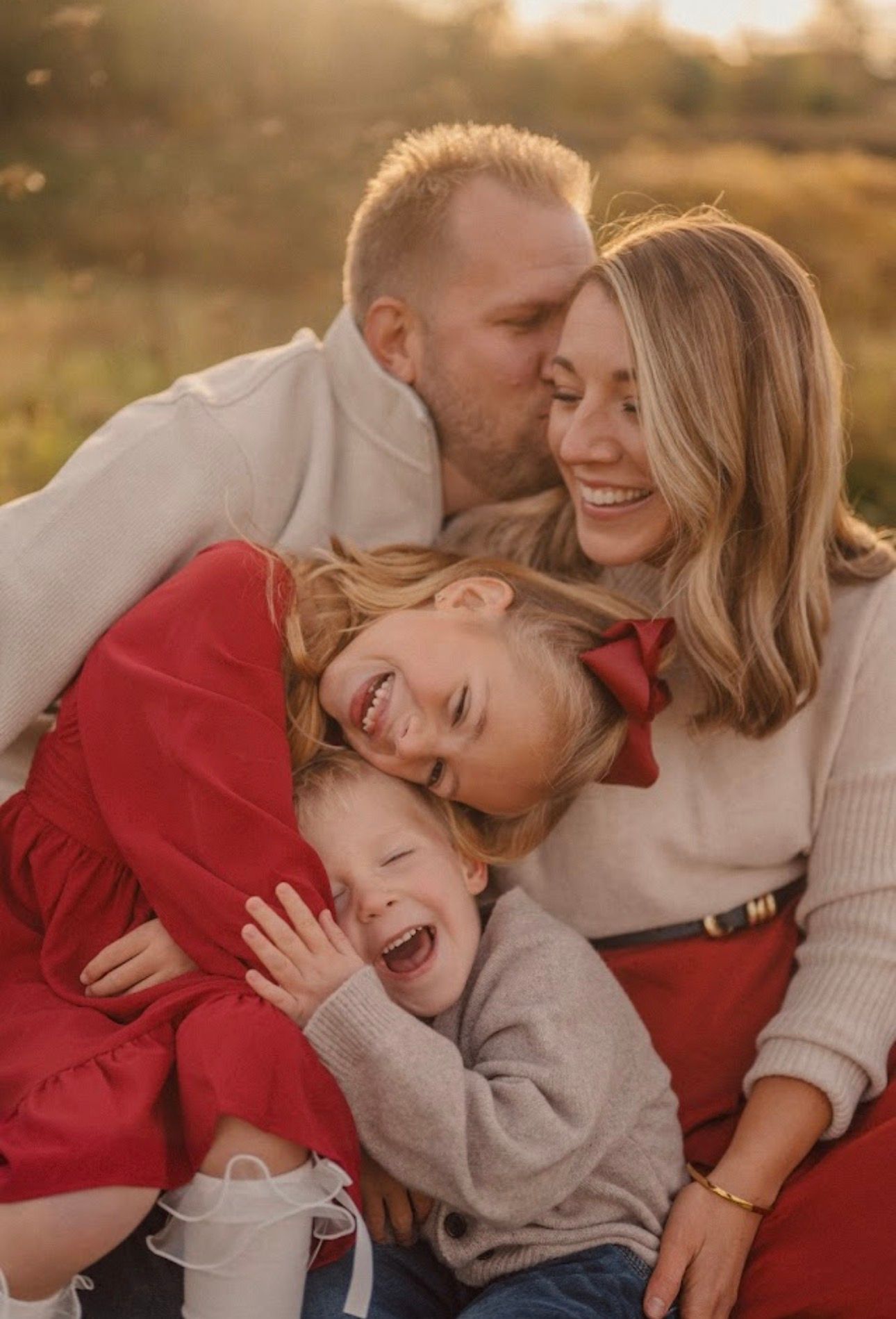 Couple sharing intimate laughing moments together during golden hour photo session.