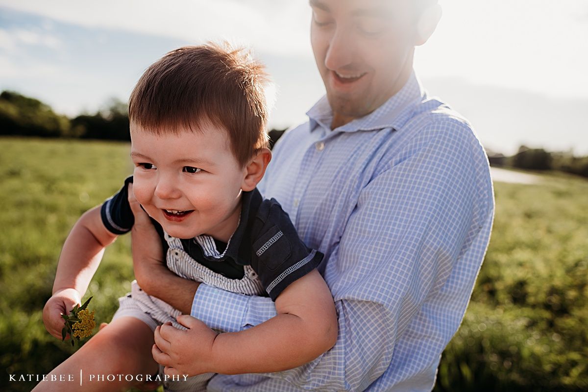 Candid portrait showing pure joy and laughter in outdoor setting with evening light.