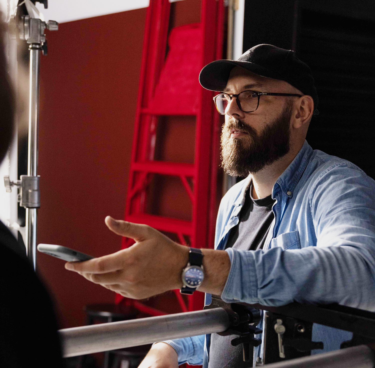 Sunshine Coast commercial photography: professional creative Samuel Dunstan on set with lighting equipment for a premium brand shoot