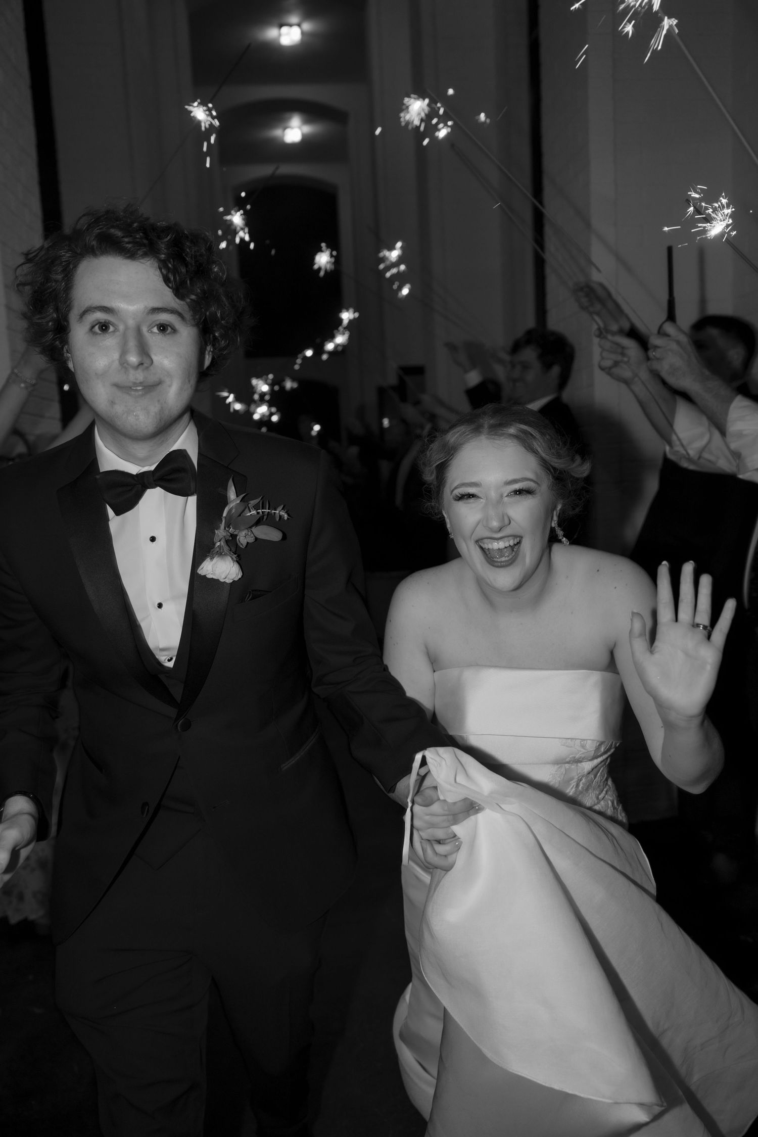 Black and white reception photos with sparklers creating a festive atmosphere.