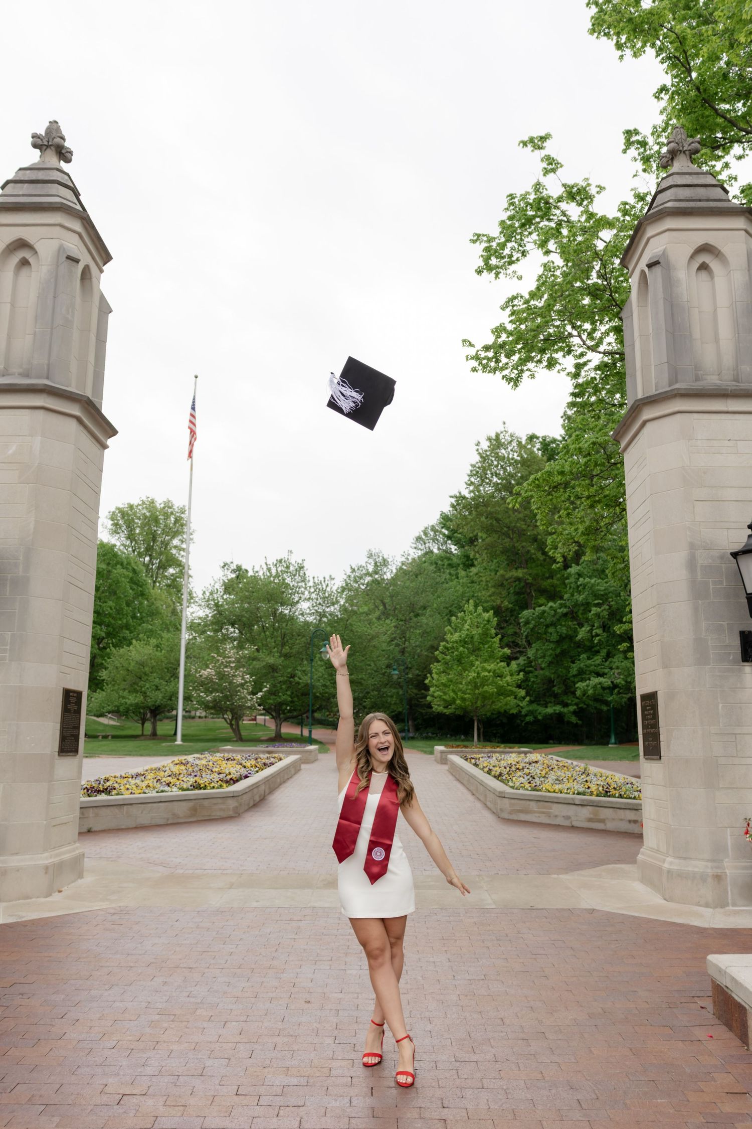 Stone gateway entrance with architectural pillars at a university campus.