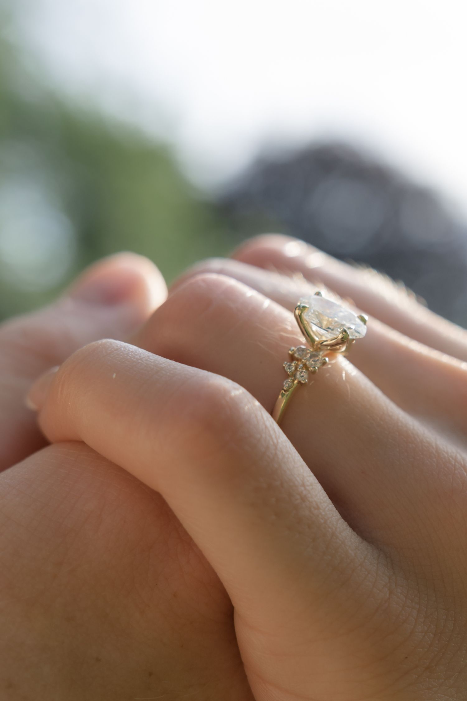 Close-up view of a stunning engagement ring with a crystal clear diamond in natural lighting.