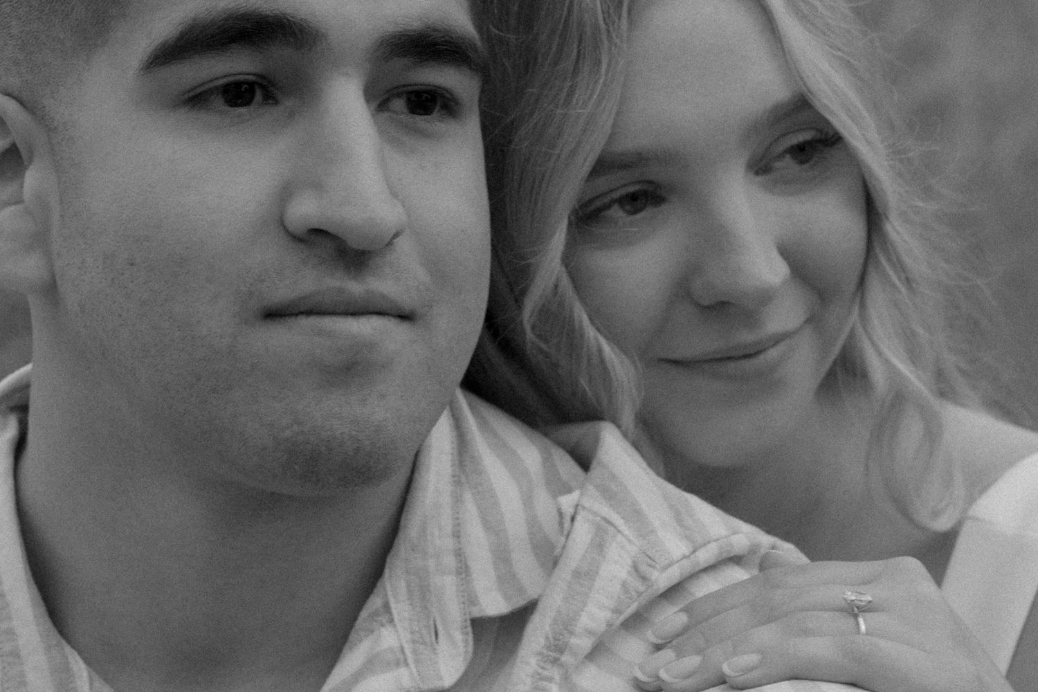 A romantic black and white portrait of a couple sharing tender moments together.
