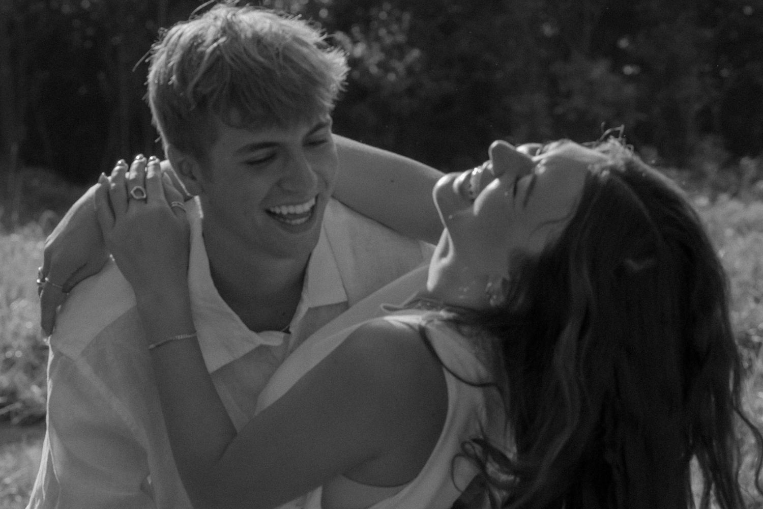 A loving black and white photo sequence showing tender moments between a couple.