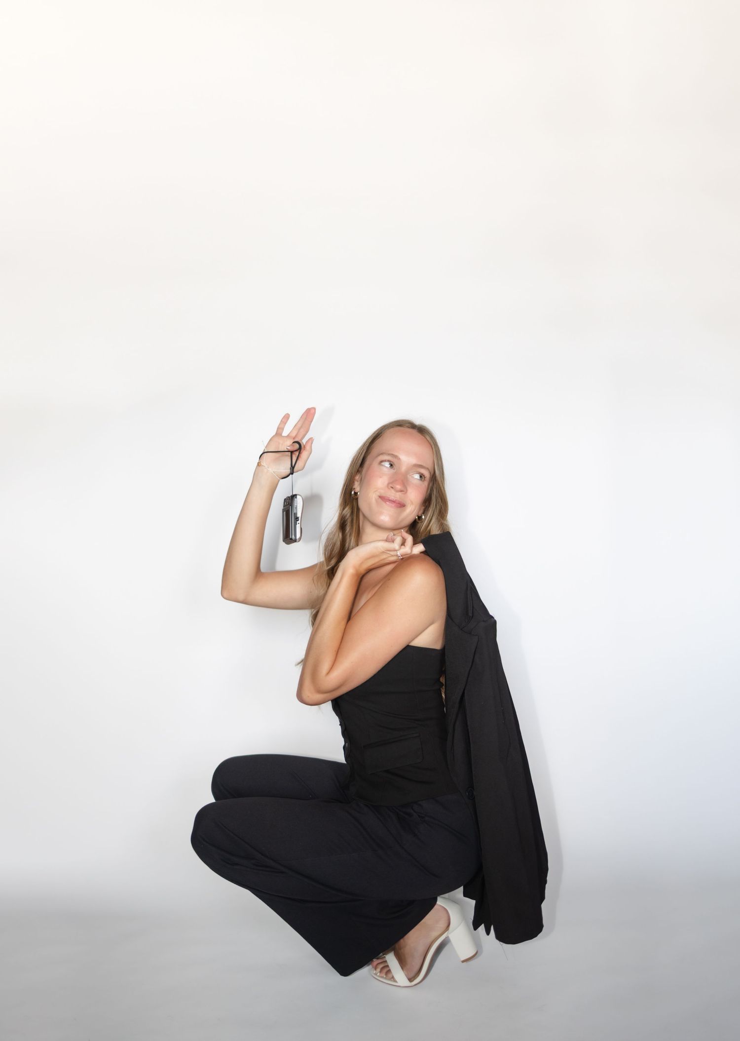 Stylized studio portraits showing artistic poses against white background.