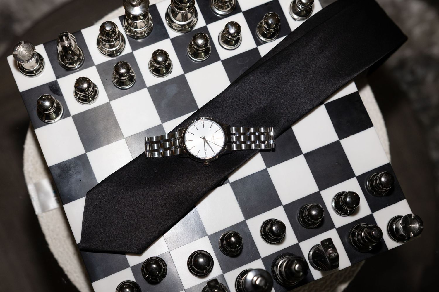 Close-up view of a chess board setup with white and black pieces in classic arrangement.