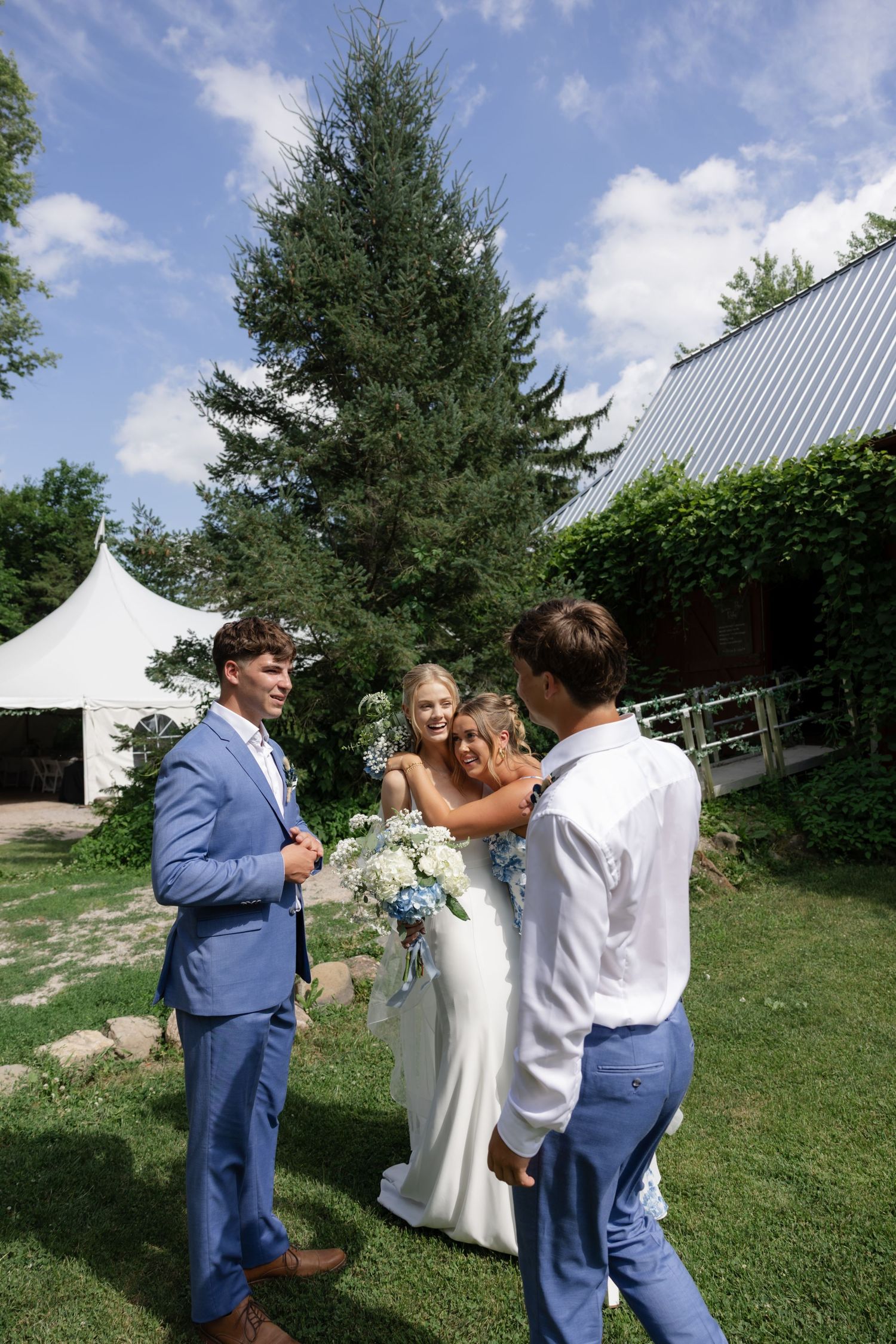 Wedding photography session on sunny hillside with photographer capturing couple's portraits.