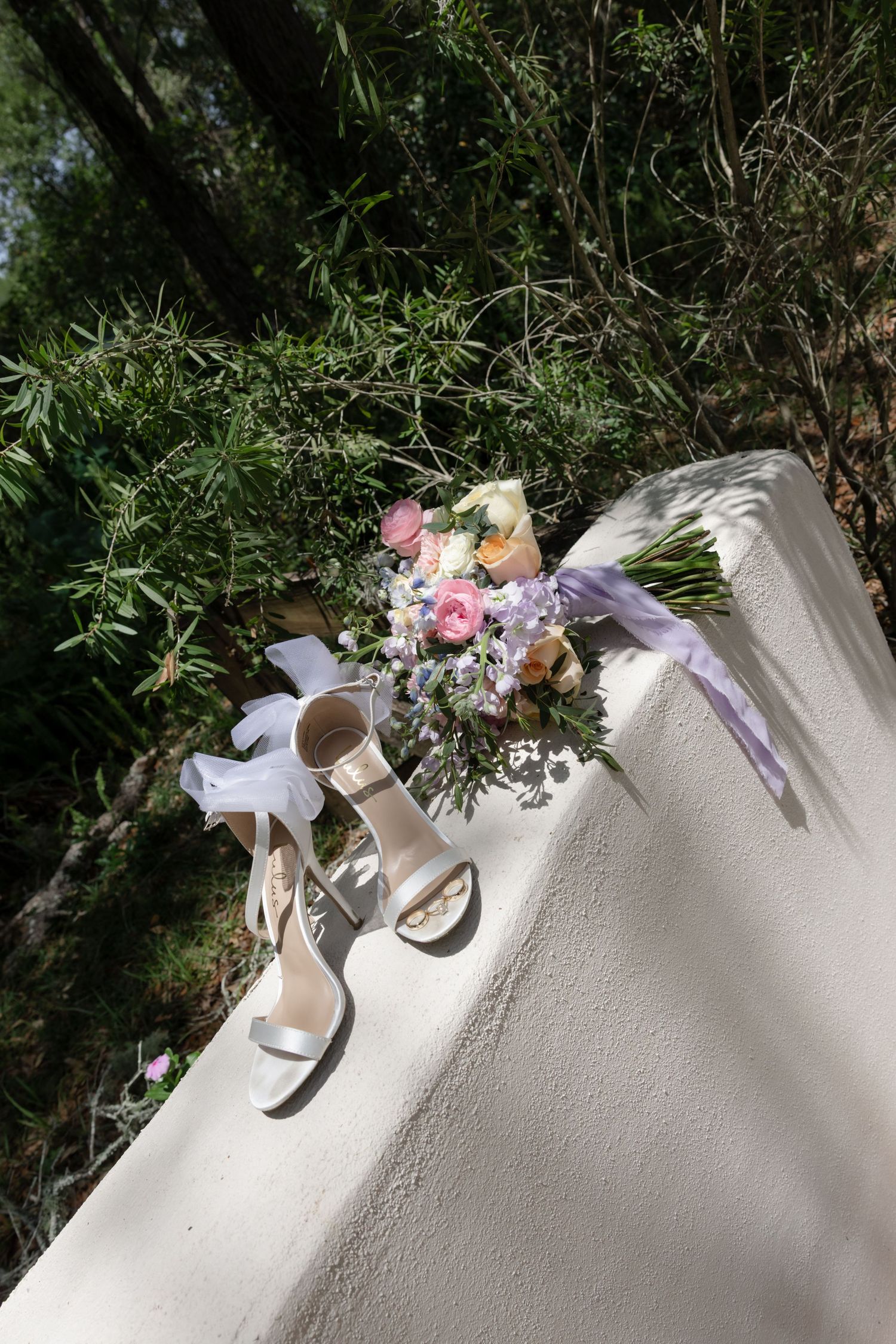 A series of detail shots showing delicate floral arrangements and decorative elements on a white surface.