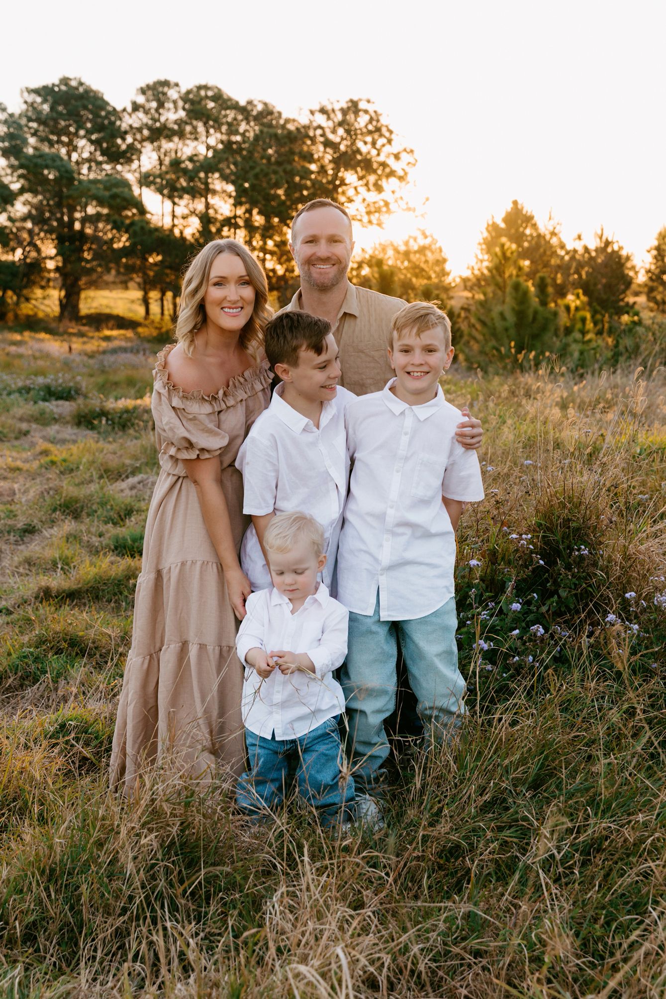 Family photography showing a golden hour portrait in a field at Brisbane Queensland location.