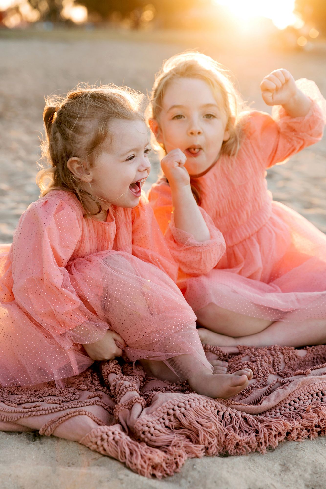 Victoria Point family photography of two sisters at bayside foreshore.
