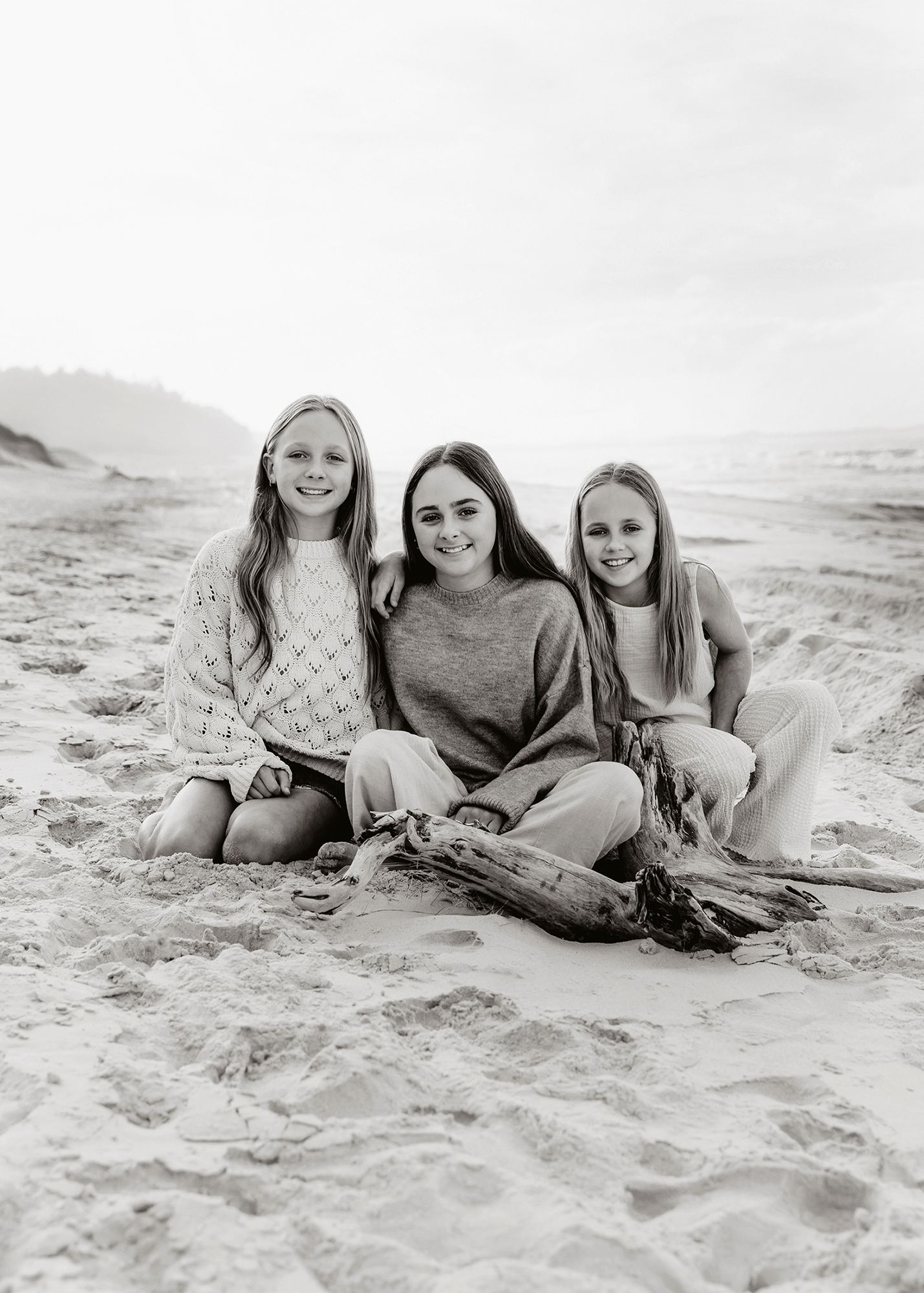 Timeless black and white sister photograph on Stradbroke Island.