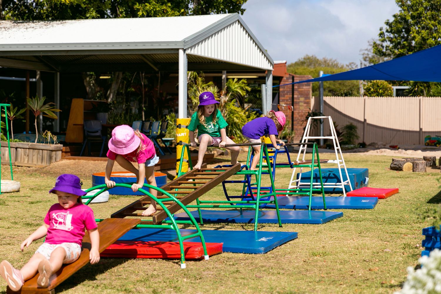 Kindergarten business photography showing panoramic view of playground and activity stations for Brisbane daycare centre.