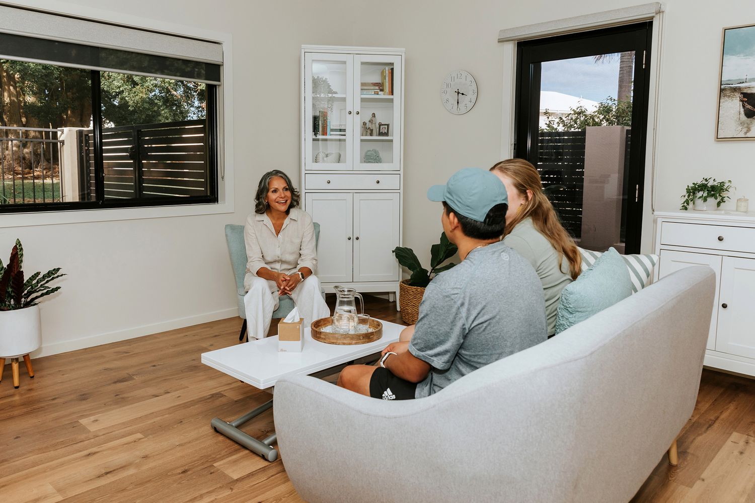 Brisbane business photography showcasing modern office interior with people working in a bright, open-plan setting.