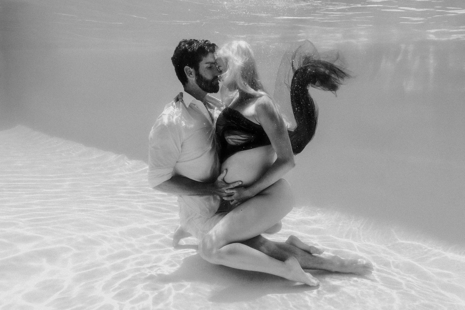 Artistic underwater maternity portrait Brisbane.