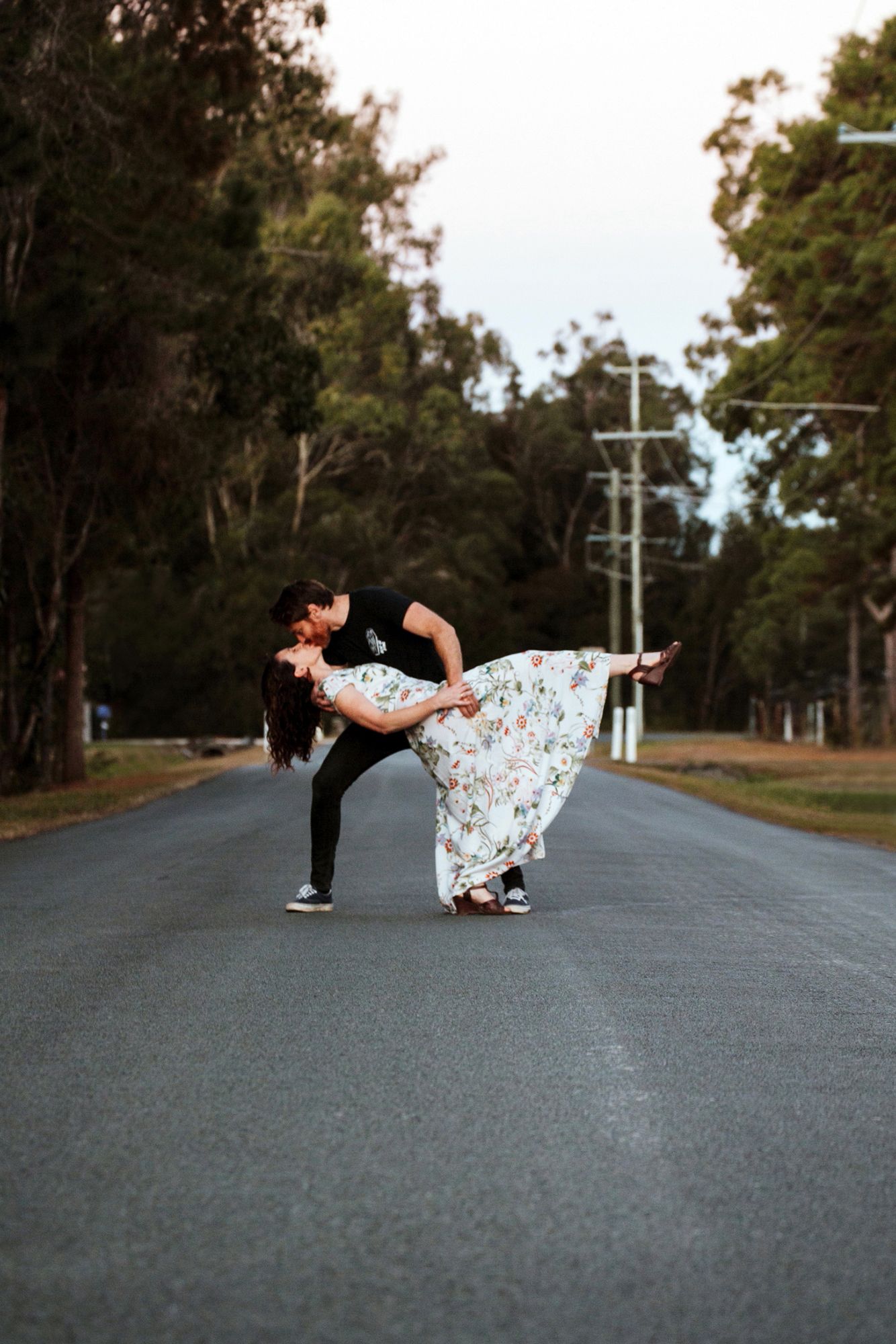 Couple photo shoot on deserted road in Brisbane.