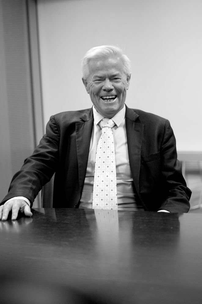Brisbane business photographer illustrates a black and white photo sequence showing progressive laughter during a business meeting.
