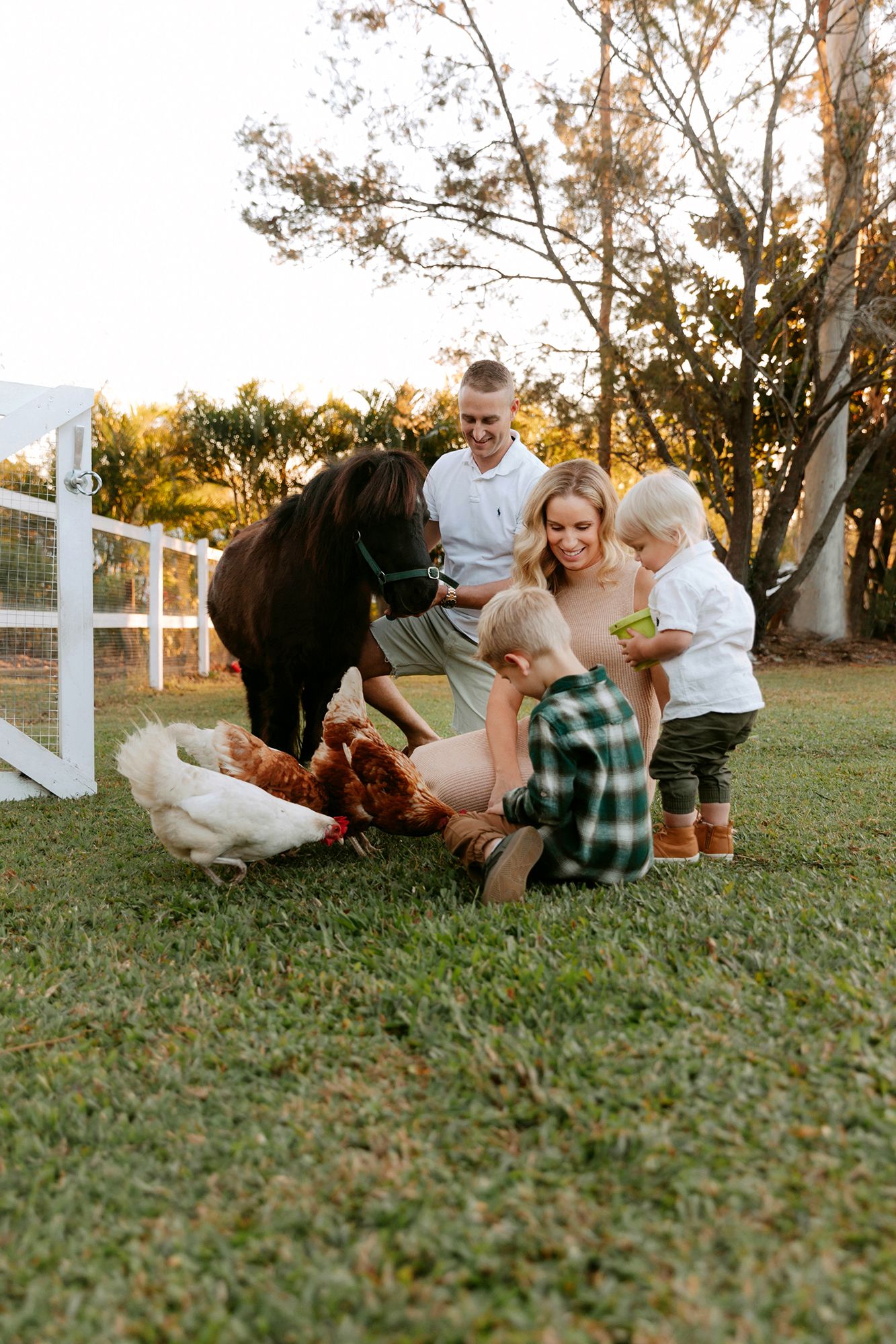 Brisbane at home pet family photography featuring Mum, Dad, pony and chickens.