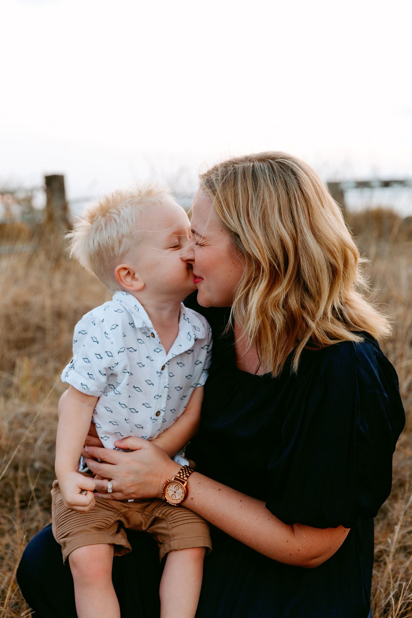 Redlands family photography in grassy field at Mt Cotton Queensland.