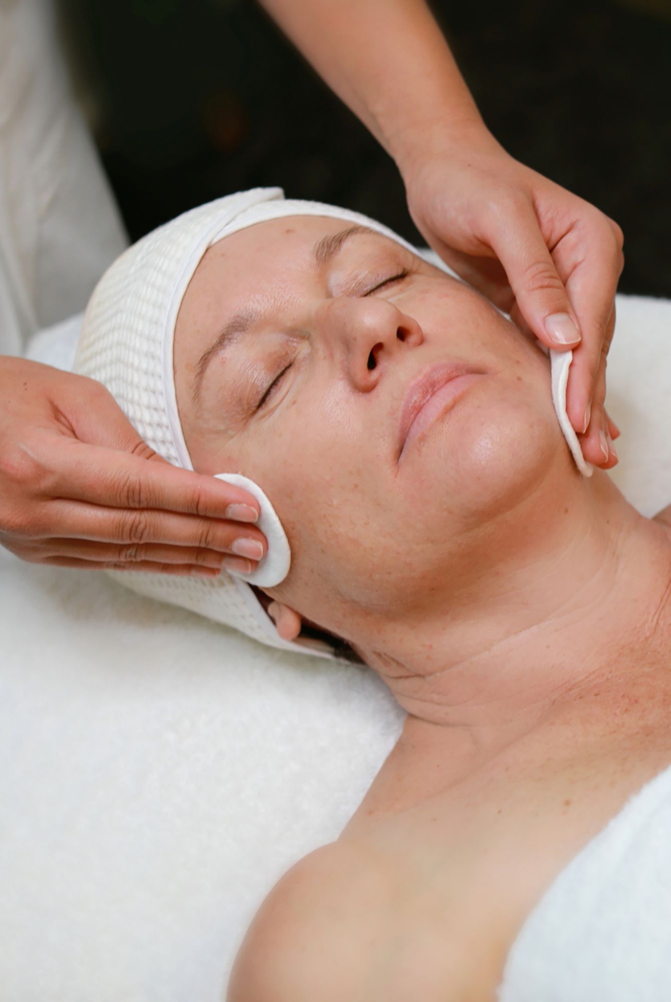 Business photographer showcasing professional facial massage therapy treatment being performed on a client at a luxury spa at Cleveland Qld.