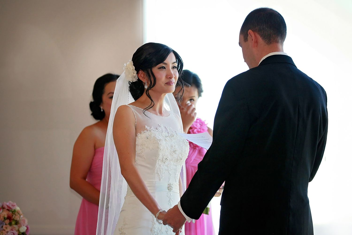 Brisbane wedding photographer captures tender, candid moment between bride and groom.