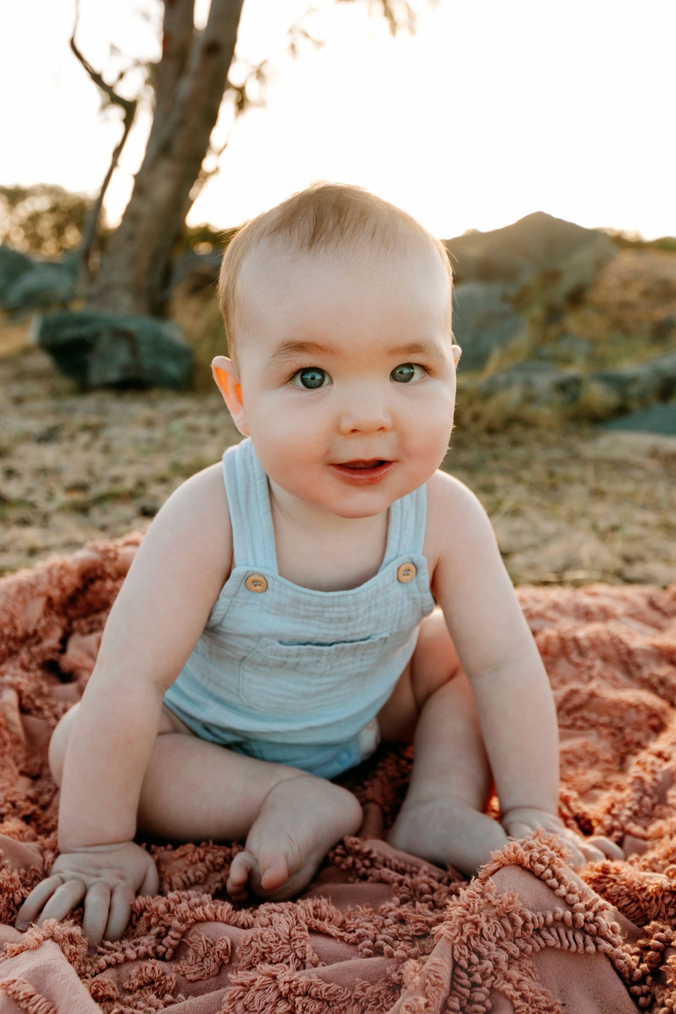 Baby poses in a series of candid outdoor shots for Brisbane family photography.