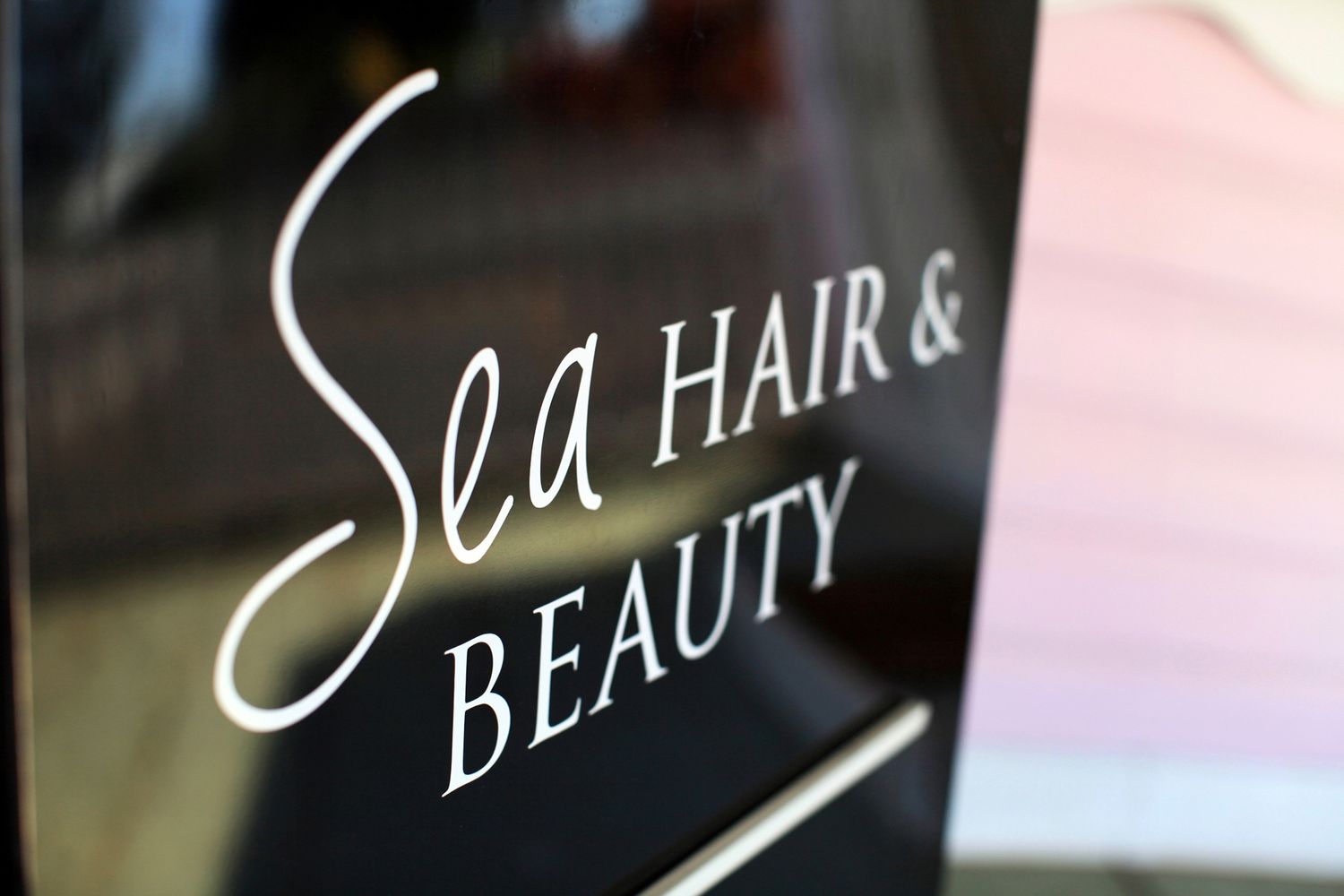 Creative brand and logo design for beauty salon signage in Ormiston.