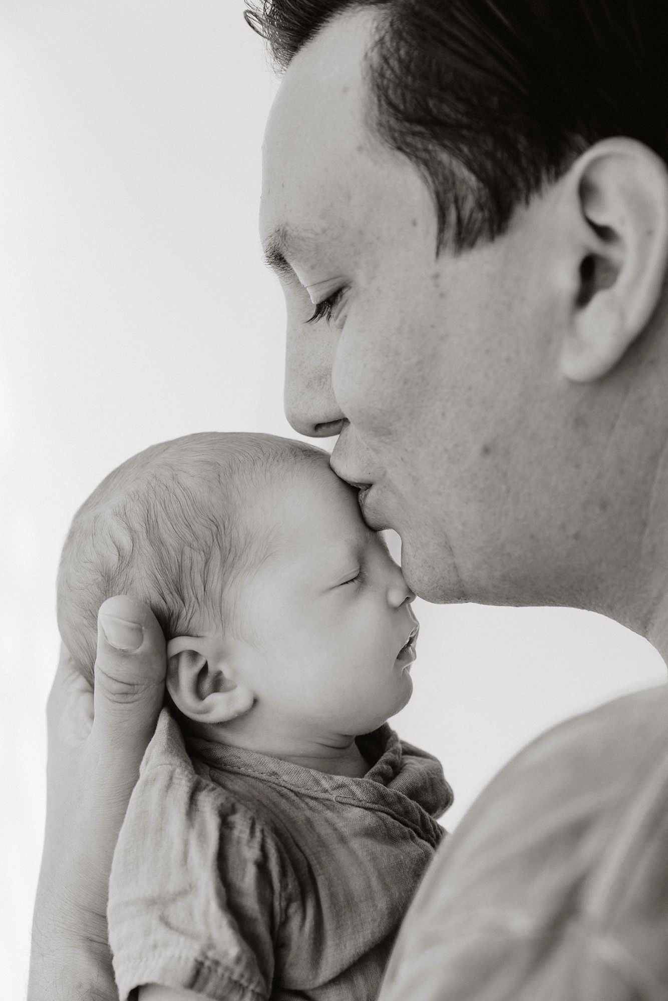 Black and white portrait of father and baby. Brisbane Redlands newborn photography.