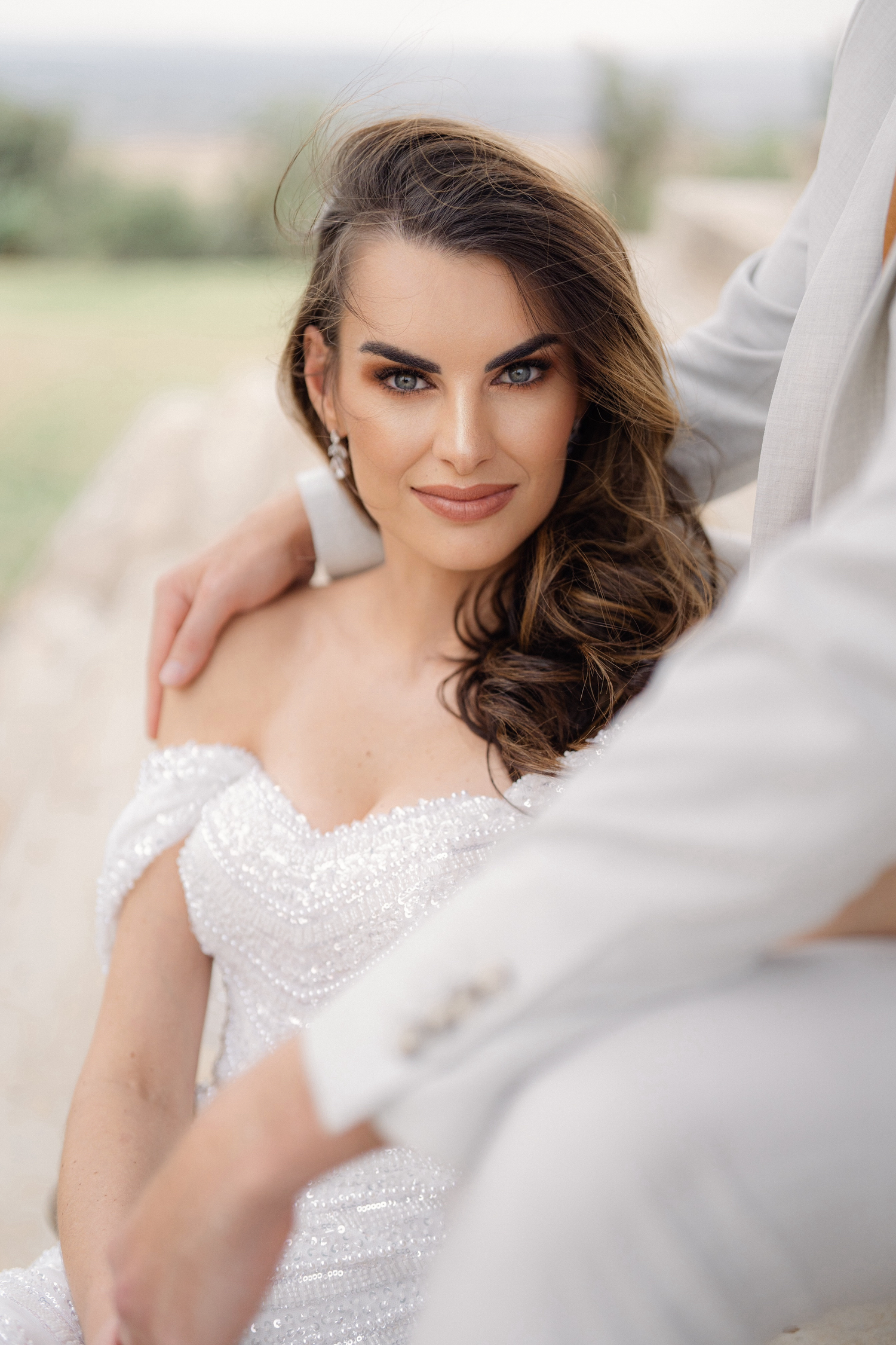 Soft portrait series featuring romantic bridal photography in white lace against light ethereal background.
