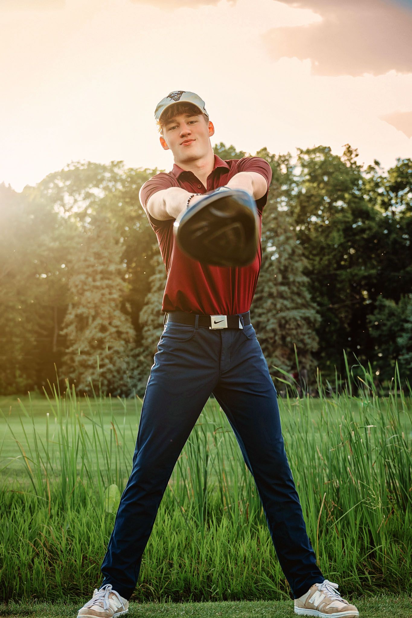 Dynamic poses in tall grass field during golden hour sunset.