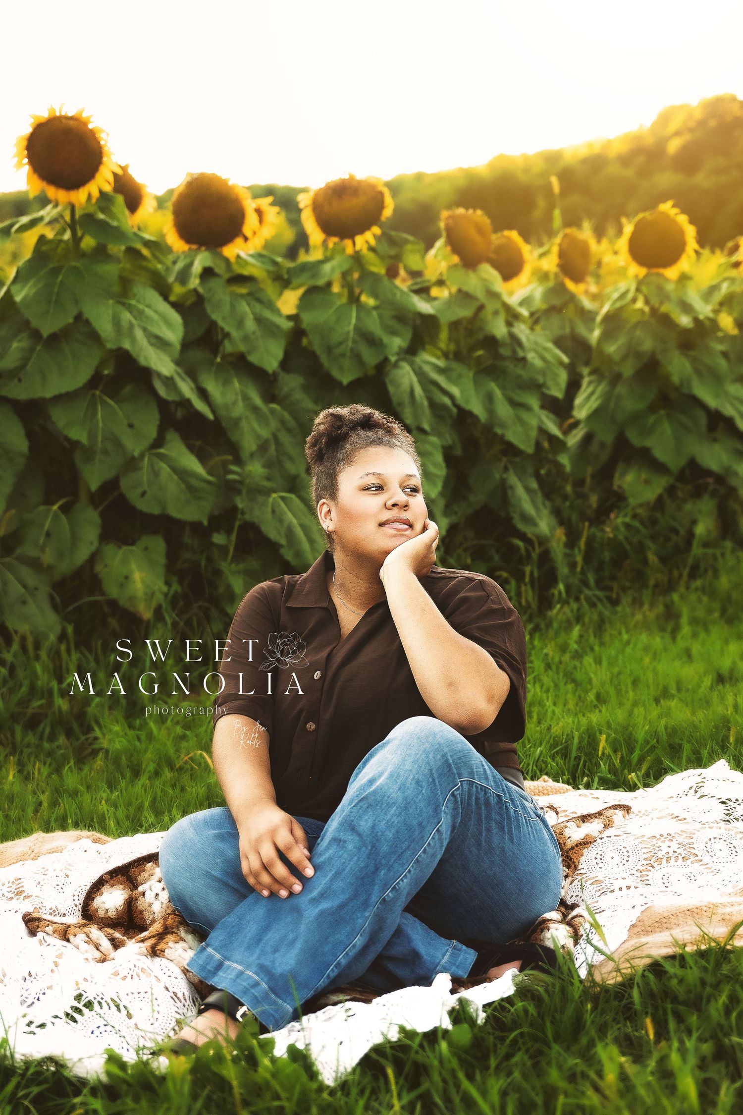 Relaxed portrait session with sunflower field backdrop at sunset.