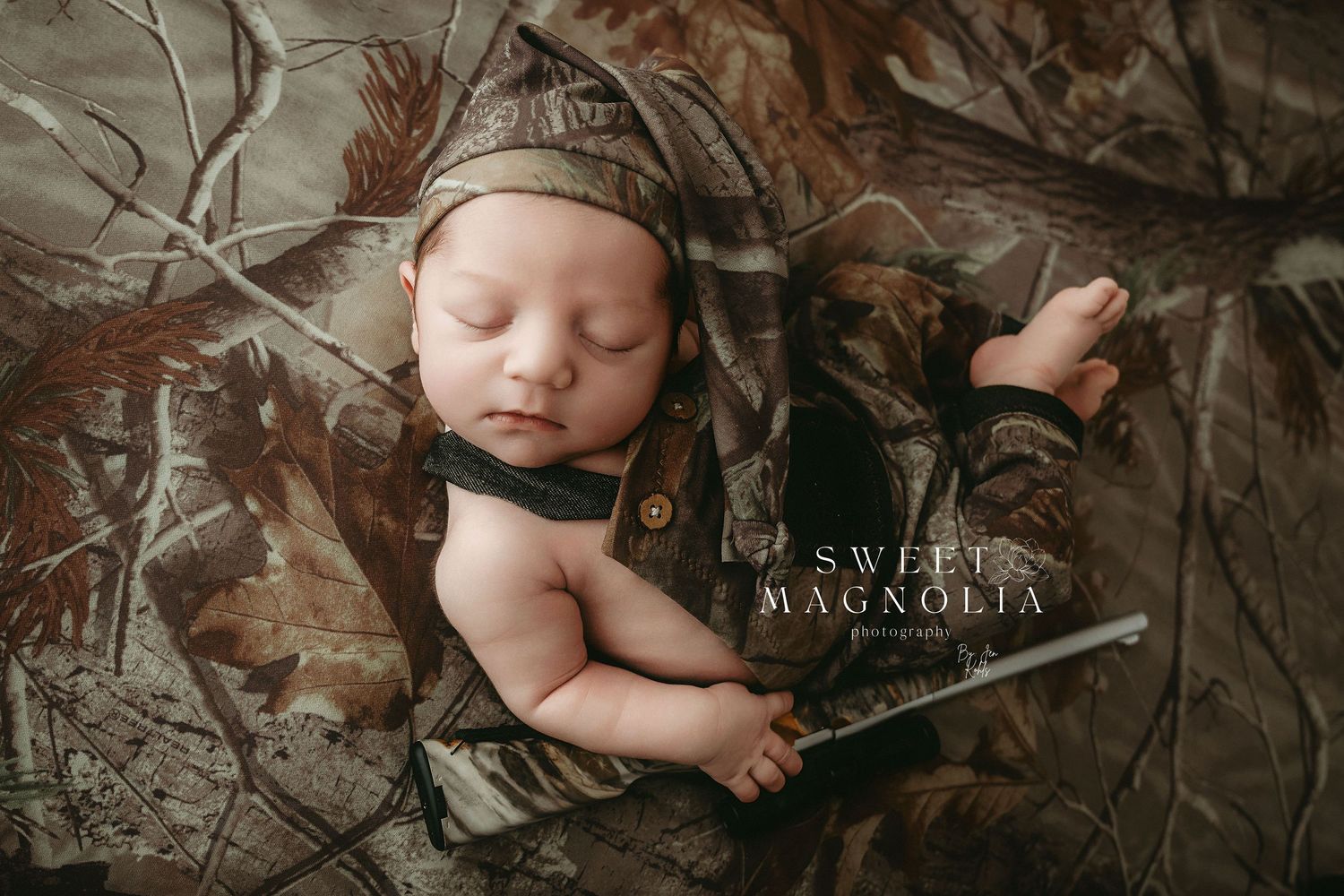 Professional newborn photography featuring rustic woodland elements and natural textures.